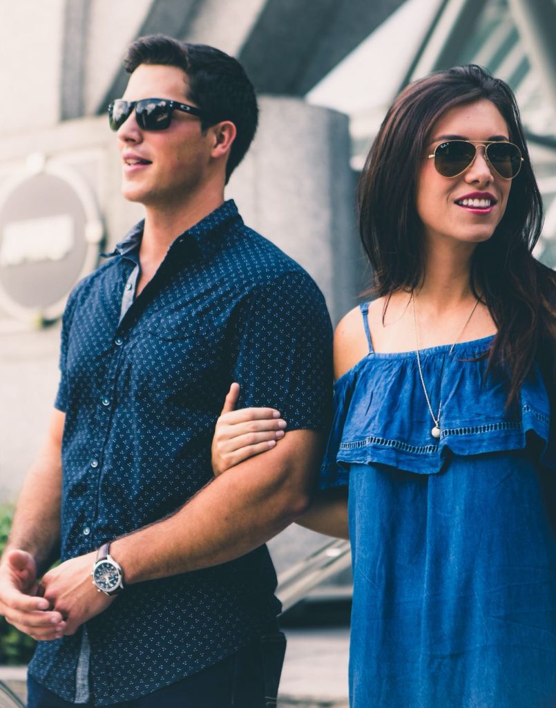 A happy couple standing together, symbolizing emotional connection and mutual understanding in relationships.